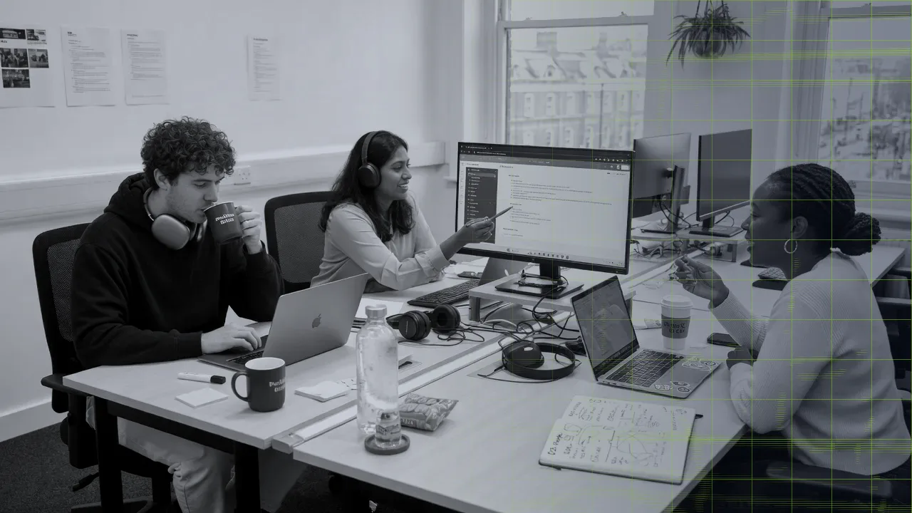 Small business team working together on laptops in a London coworking office