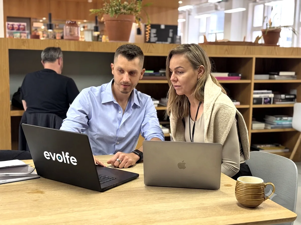 Evolfe consultants advising a client in a London coworking space